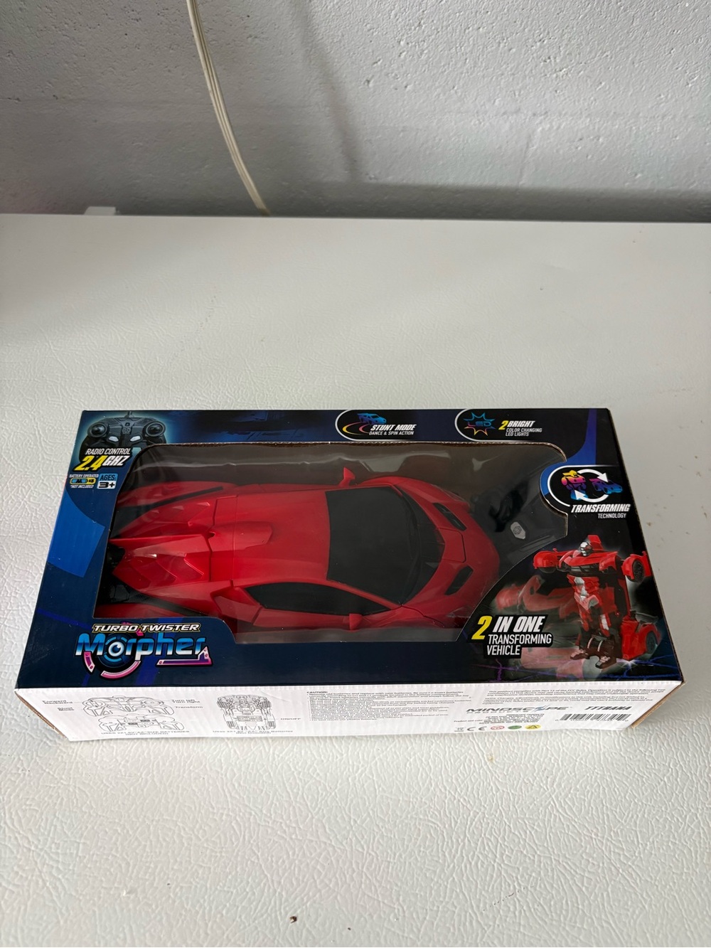 Red Mindscope Turbo Twister Morpher RC Car, a 2-in-1 radio-controlled toy